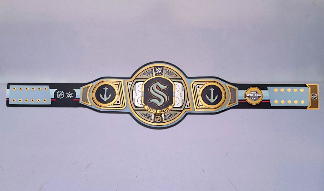 Detailed view of the Seattle Kraken WWE Championship Belt, featuring embossed logos and a polished finish.