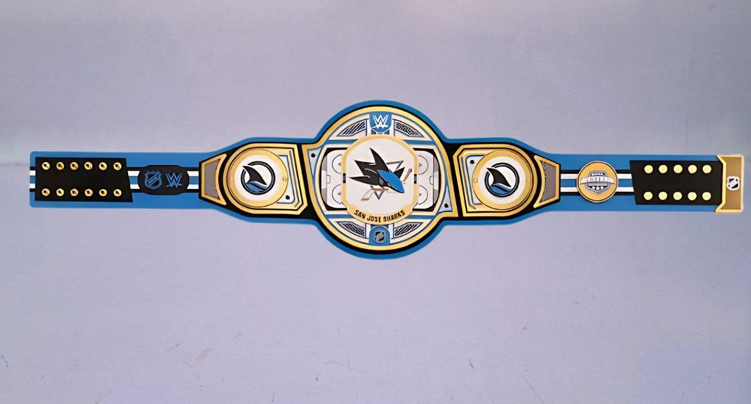 Detailed view of the San Jose Sharks WWE Championship Belt, featuring embossed logos and a polished finish.